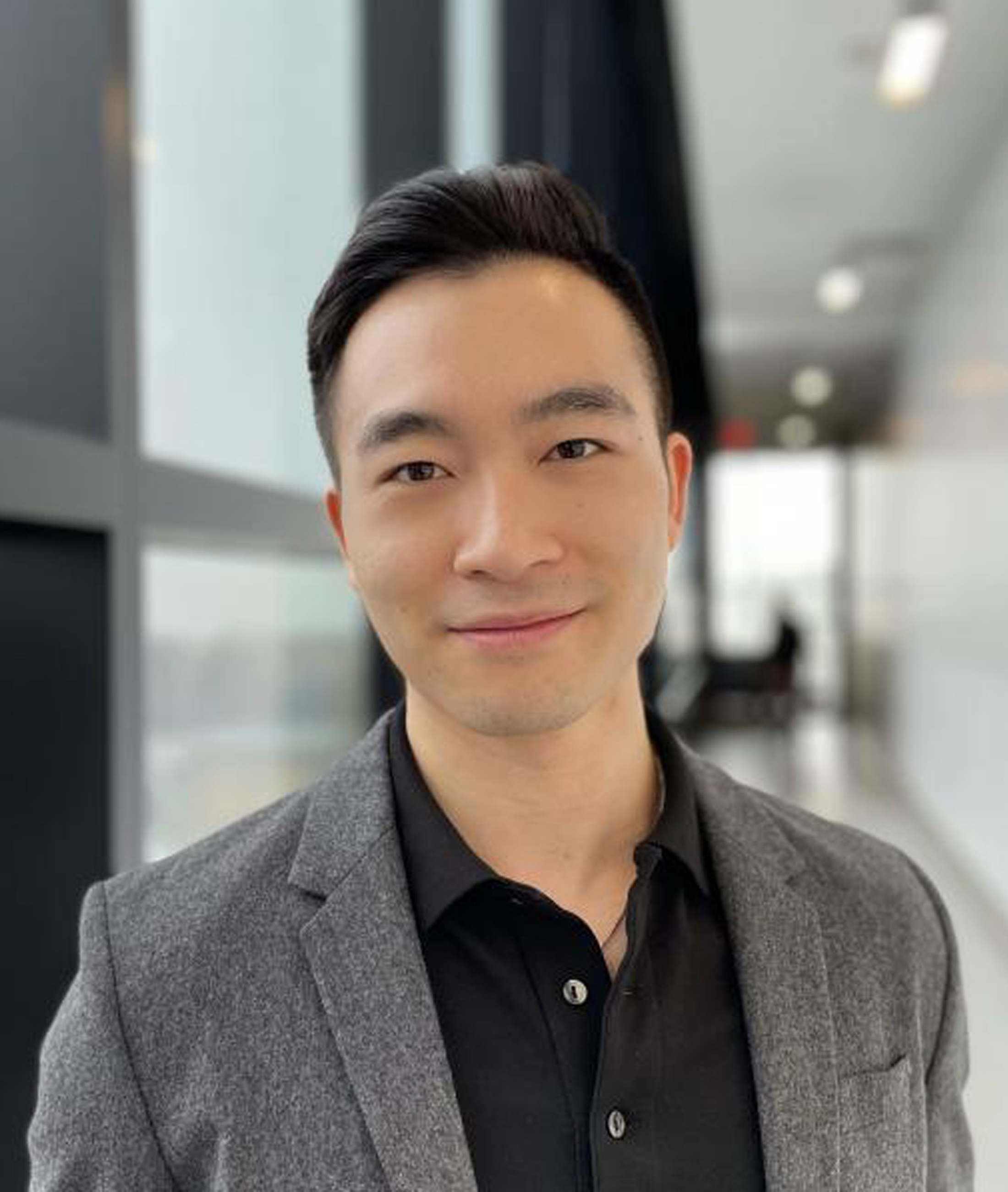 Headshot of Alex Tang.