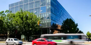 The exterior of the Pharmaceutical Sciences Building on a sunny day.