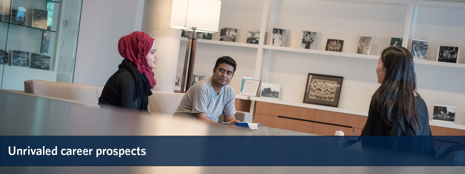 Three students conversing at a table, overlaid with the text "unrivaled career prospects".