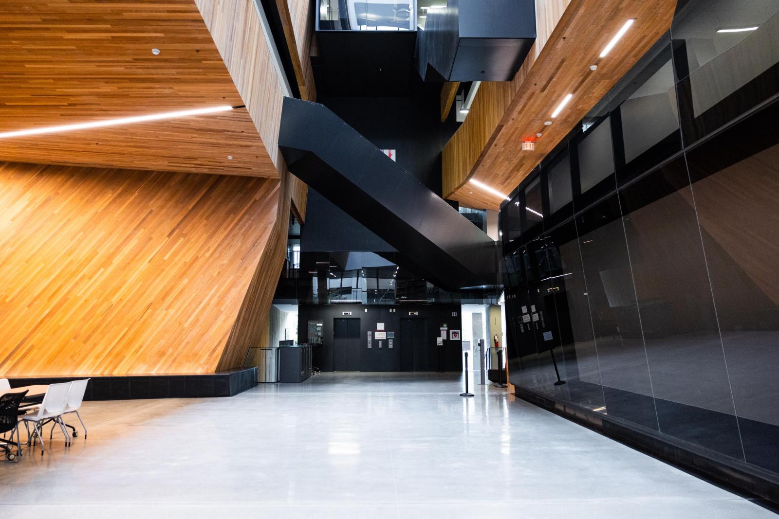 A photo of the first floor of the UBC Pharmaceutical Sciences Building, including a staircase.