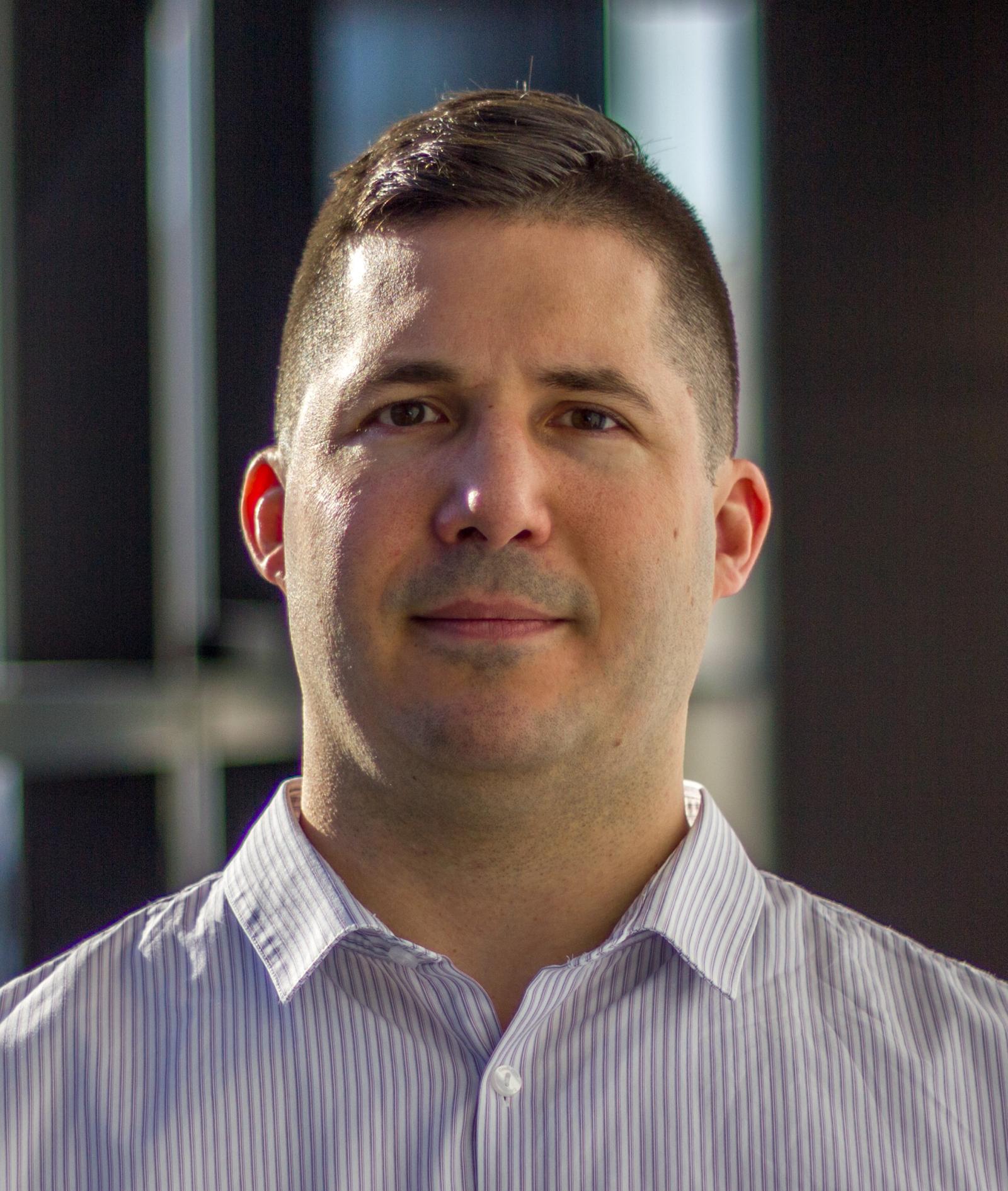 Headshot of Jon Grosshuesch.